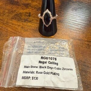 Elegant Black and Gold Ring with Intricate Design